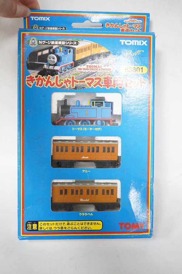 Four boxed Tomix (by Tomy) N gauge railway Thomas the Tank Engine & Friends train packs, comprising of three locomotives and rolling stock (one locomotive and a wagon missing): James (93802) - James and one wagon missing